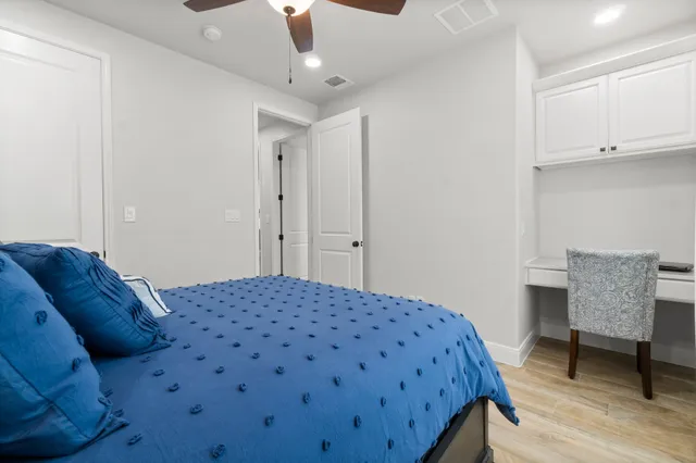 a bedroom with a bed and a chair