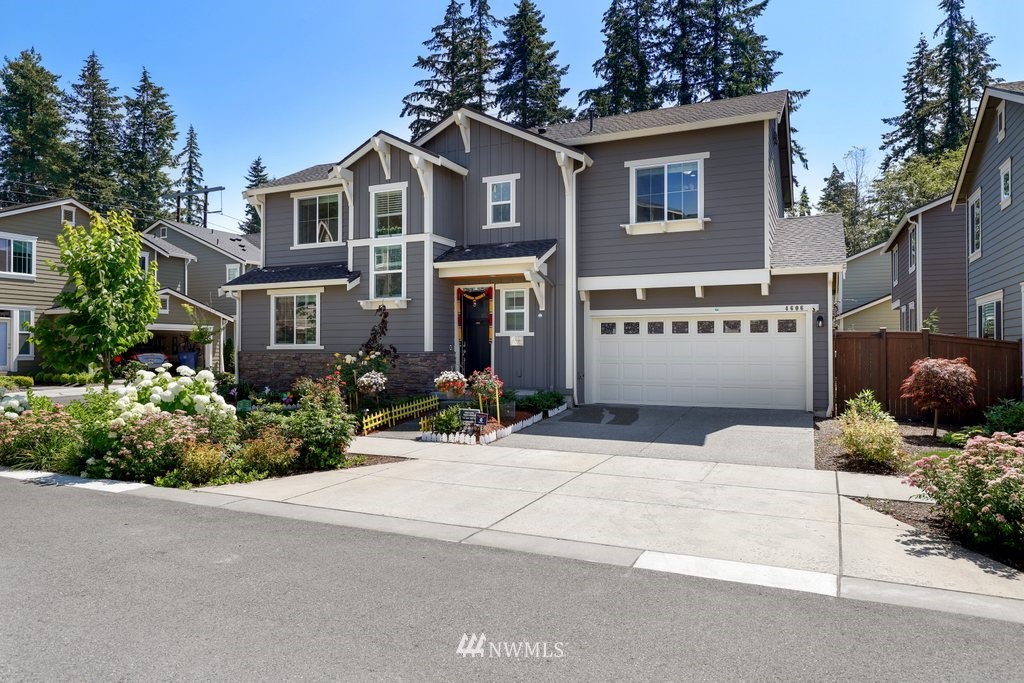 4606 187th Place Southeast Bothell, WA 98012 - Photo 2 of 40 a front view of a house with a garden