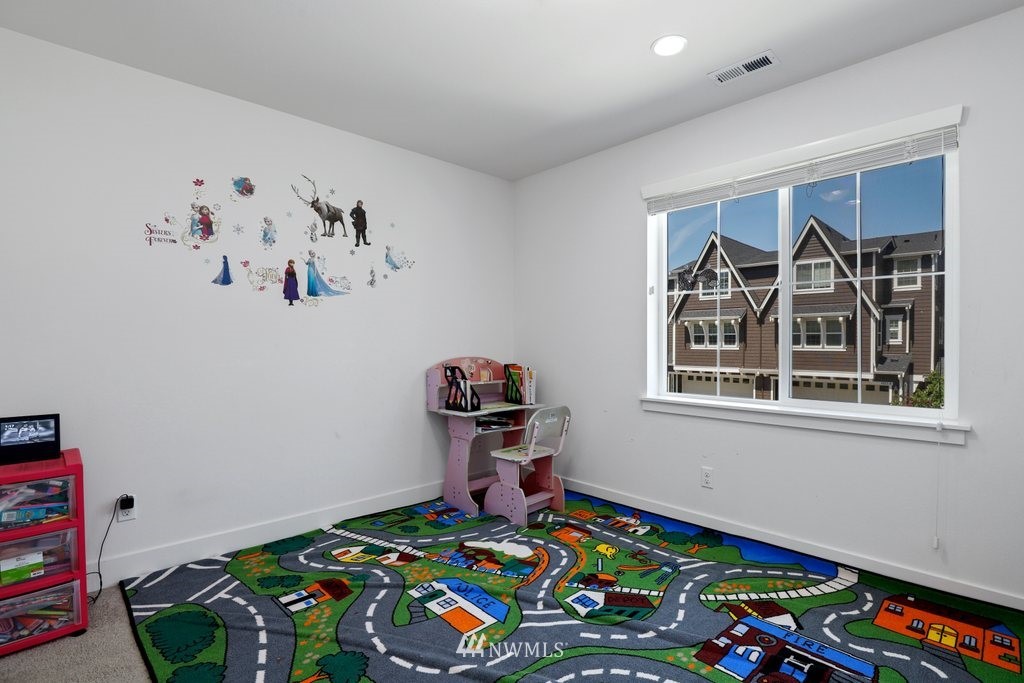 4606 187th Place Southeast Bothell, WA 98012 - Photo 21 of 40 a bedroom with toys and a book shelf