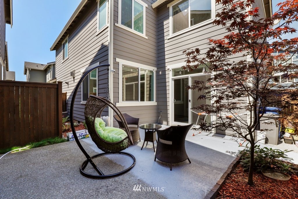 4606 187th Place Southeast Bothell, WA 98012 - Photo 25 of 40 a view of a chairs and table in backyard