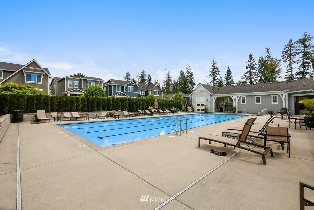 4606 187th Place Southeast Bothell, WA 98012 - Photo 33 of 40 a view of house with swimming pool outdoor seating