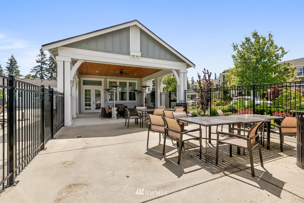 4606 187th Place Southeast Bothell, WA 98012 - Photo 39 of 40 a view of a patio with table and chairs and potted plants