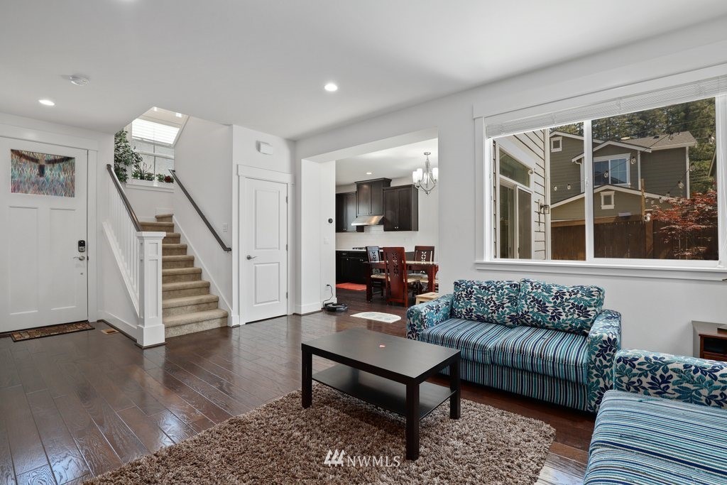 4606 187th Place Southeast Bothell, WA 98012 - Photo 5 of 40 a living room with furniture and a wooden floor
