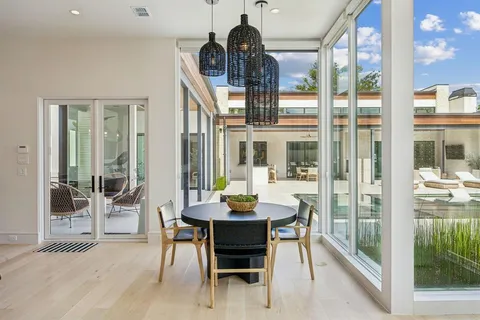 a dining room with a table and chairs
