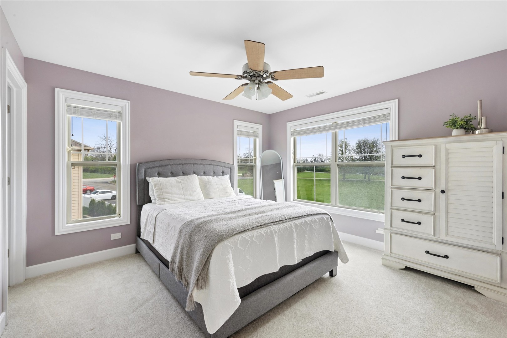 409 Provence Court Lisle, IL 60532 - Photo 14 of 24 a bed sitting in a bedroom next to a window