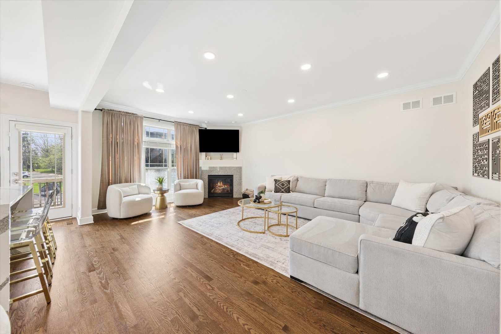 409 Provence Court Lisle, IL 60532 - Photo 7 of 24 a living room with furniture or couch and a flat screen tv
