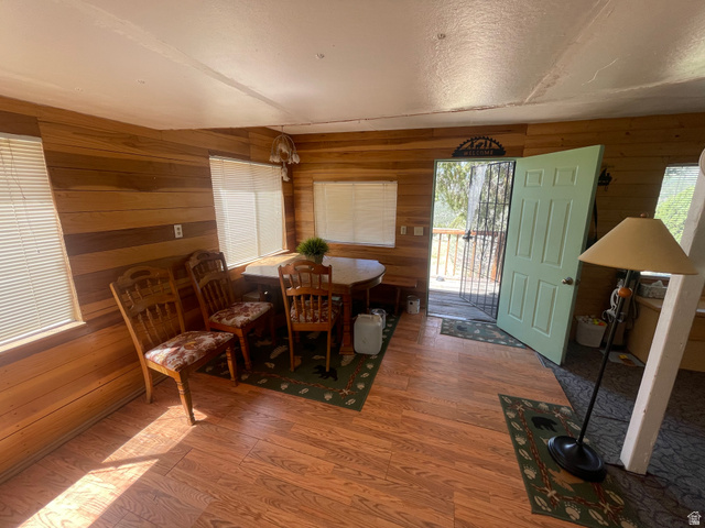 4648 West Taylor Flt Road Salina, UT 84654 - Photo 2 of 20 Interior space featuring wood-finish flooring and plank wood wall finishes