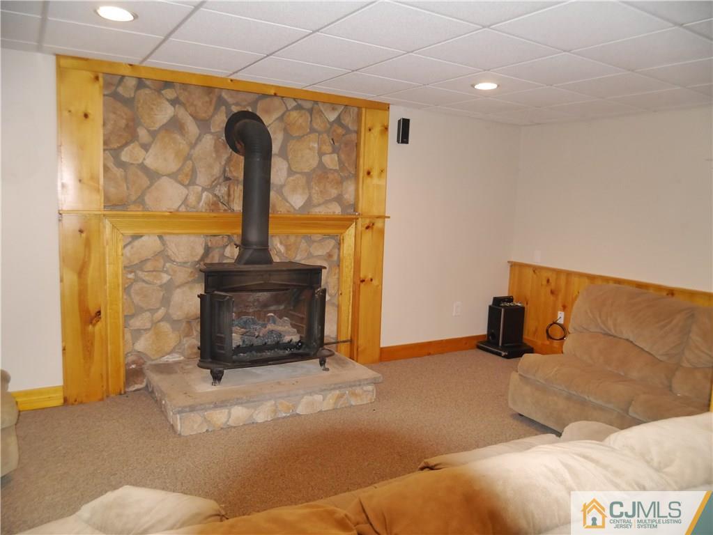 722 Old Post Road Edison, NJ 08817 - Photo 22 of 25 a bedroom with a bed and a fireplace