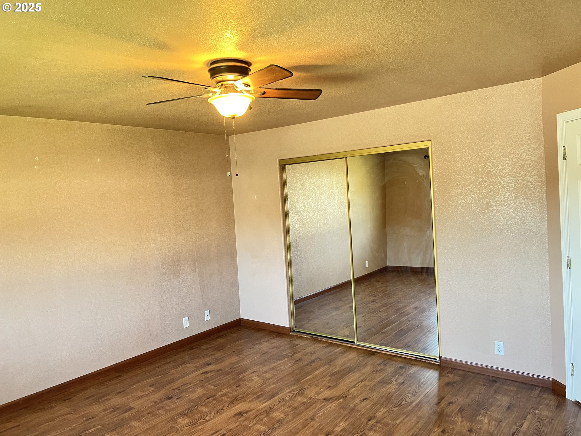 790 West Division Avenue Hermiston, OR 97838 - Photo 13 of 26 a view of an empty room with wooden floor