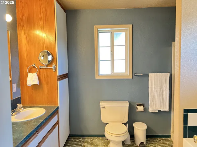 a bathroom with a bathtub and a toilet