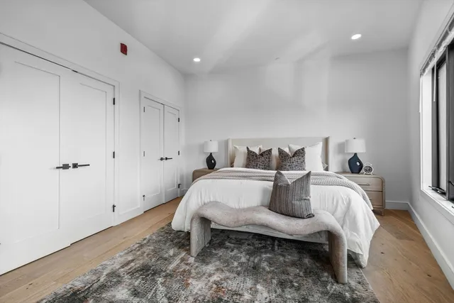 a bed room with a bed and a window