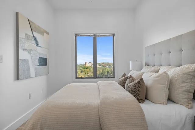 a bed room with a bed and a window