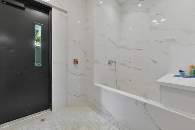 a view of bathroom and shower