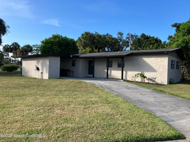 a house with trees in the background