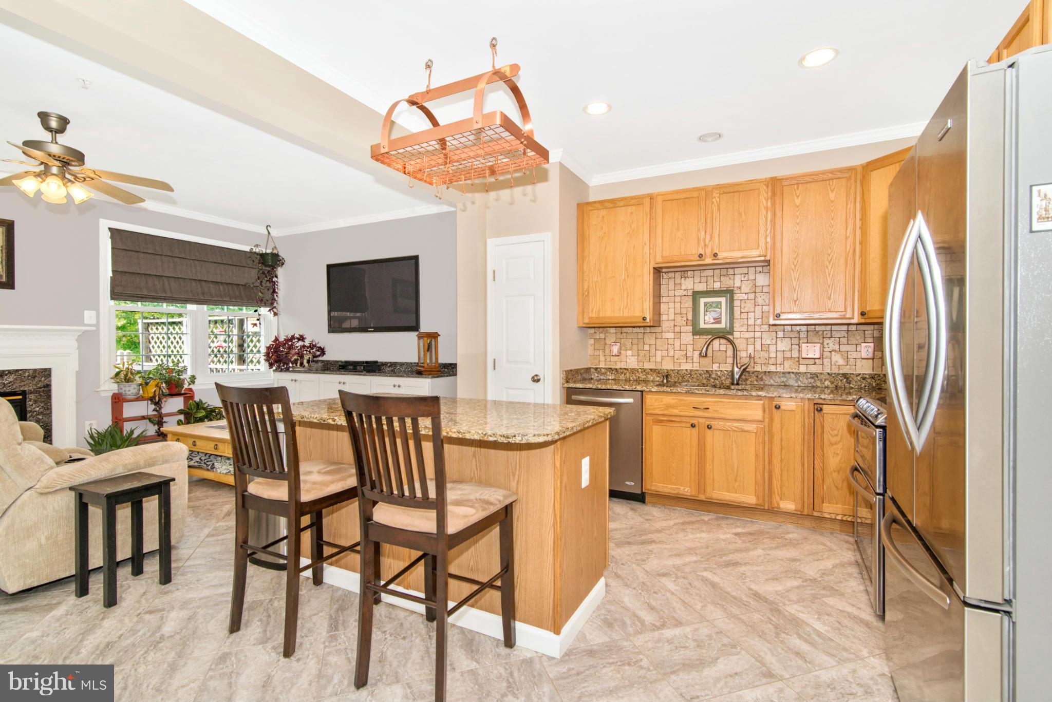 1830 Country Run Way Frederick, MD 21702 - Photo 11 of 30 Kitchen with Island and Breakfast Bar