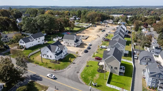 an aerial view of houses with outdoor space