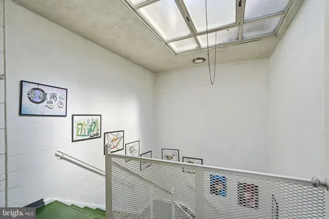 a view of a hallway with seating area