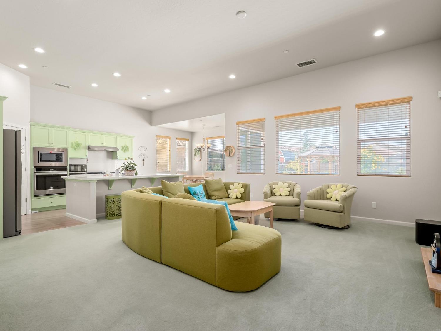 1012 Las Rosas Avenue Clovis, CA 93619 - Photo 3 of 36 a living room with furniture and a large window