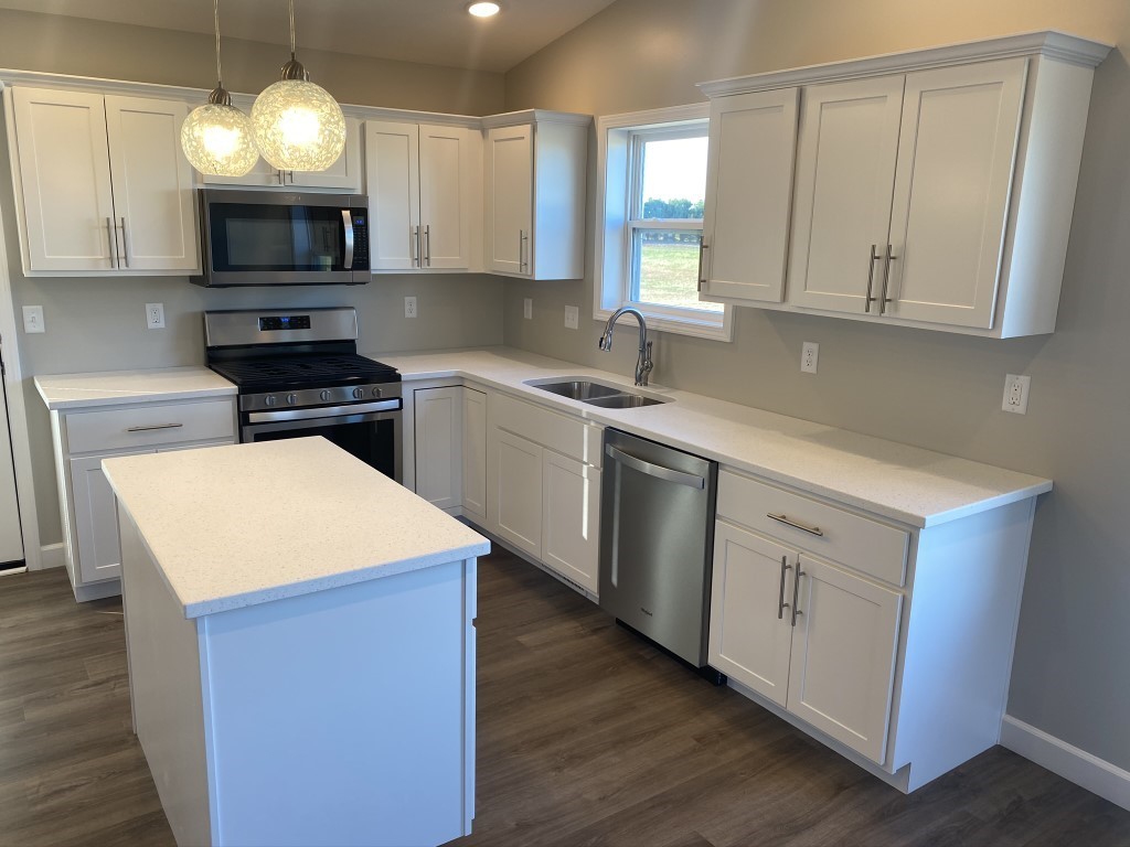 35 Winding Way Bloomington, IL 61705 - Photo 3 of 16 a kitchen with stainless steel appliances a stove a sink and a microwave
