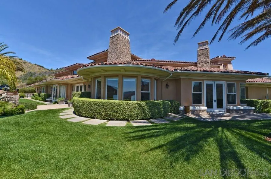 a front view of a house with a yard and porch