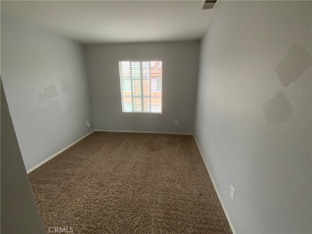 914 Sparrow Way Perris, CA 92571 - Photo 11 of 23 an empty room with a empty space and window