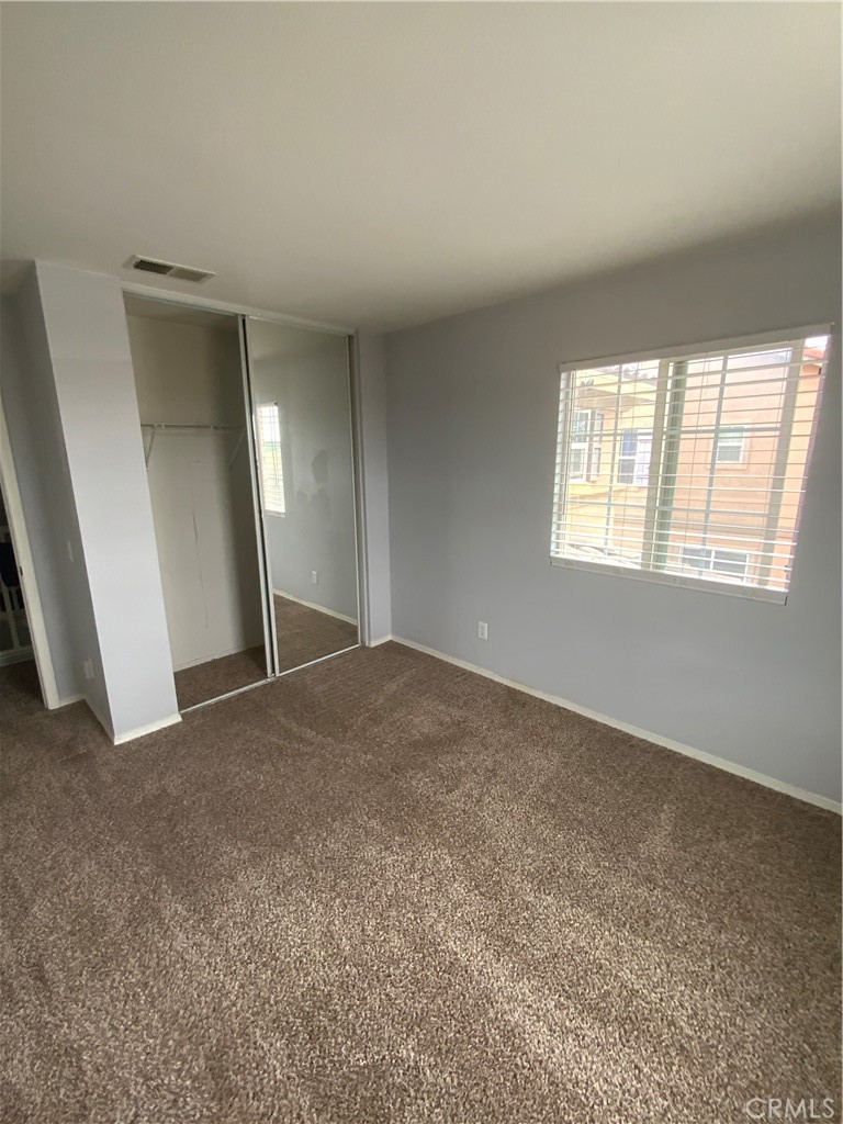 914 Sparrow Way Perris, CA 92571 - Photo 16 of 23 a view of a big room with windows and closet