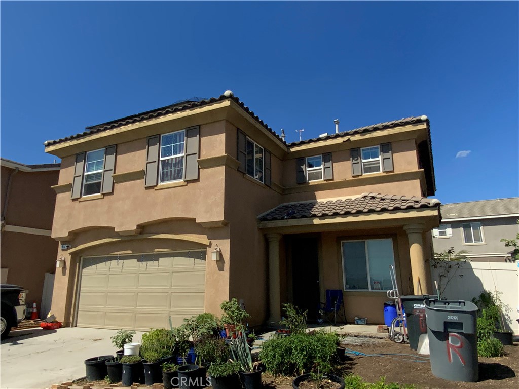 914 Sparrow Way Perris, CA 92571 - Photo 2 of 23 a front view of a house