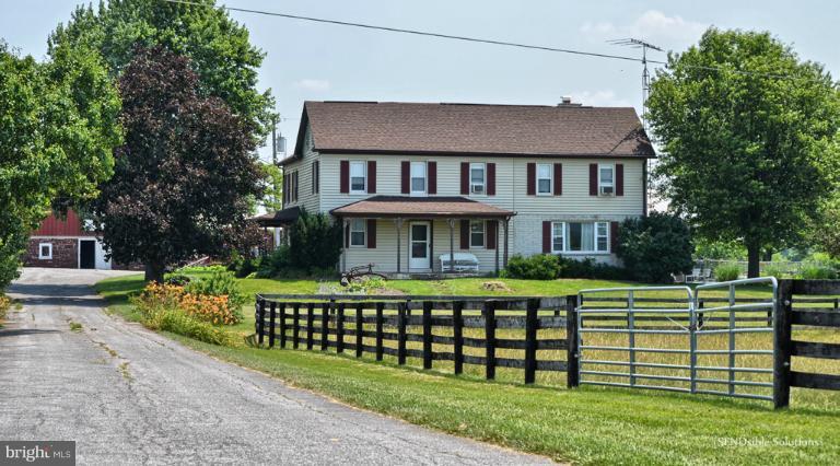 13127 Graceham Road Rocky Ridge, MD 21778 - Photo 1 of 19 a front view of a house with a garden