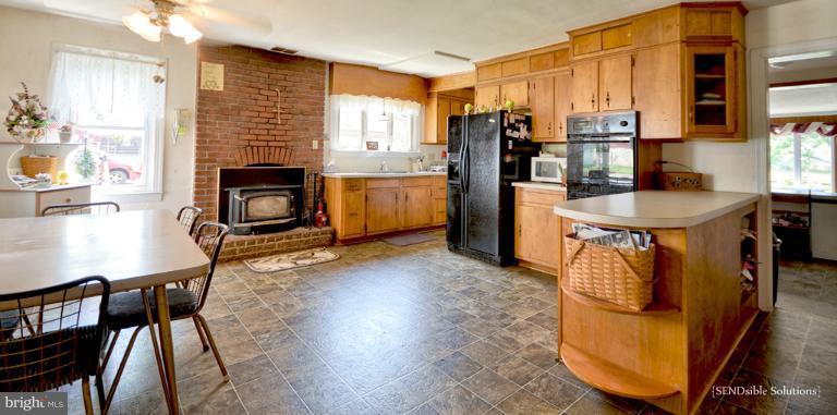 13127 Graceham Road Rocky Ridge, MD 21778 - Photo 11 of 19 a kitchen with sink refrigerator and stove