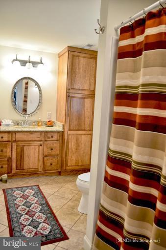 13127 Graceham Road Rocky Ridge, MD 21778 - Photo 15 of 19 a bathroom with a sink and a mirror