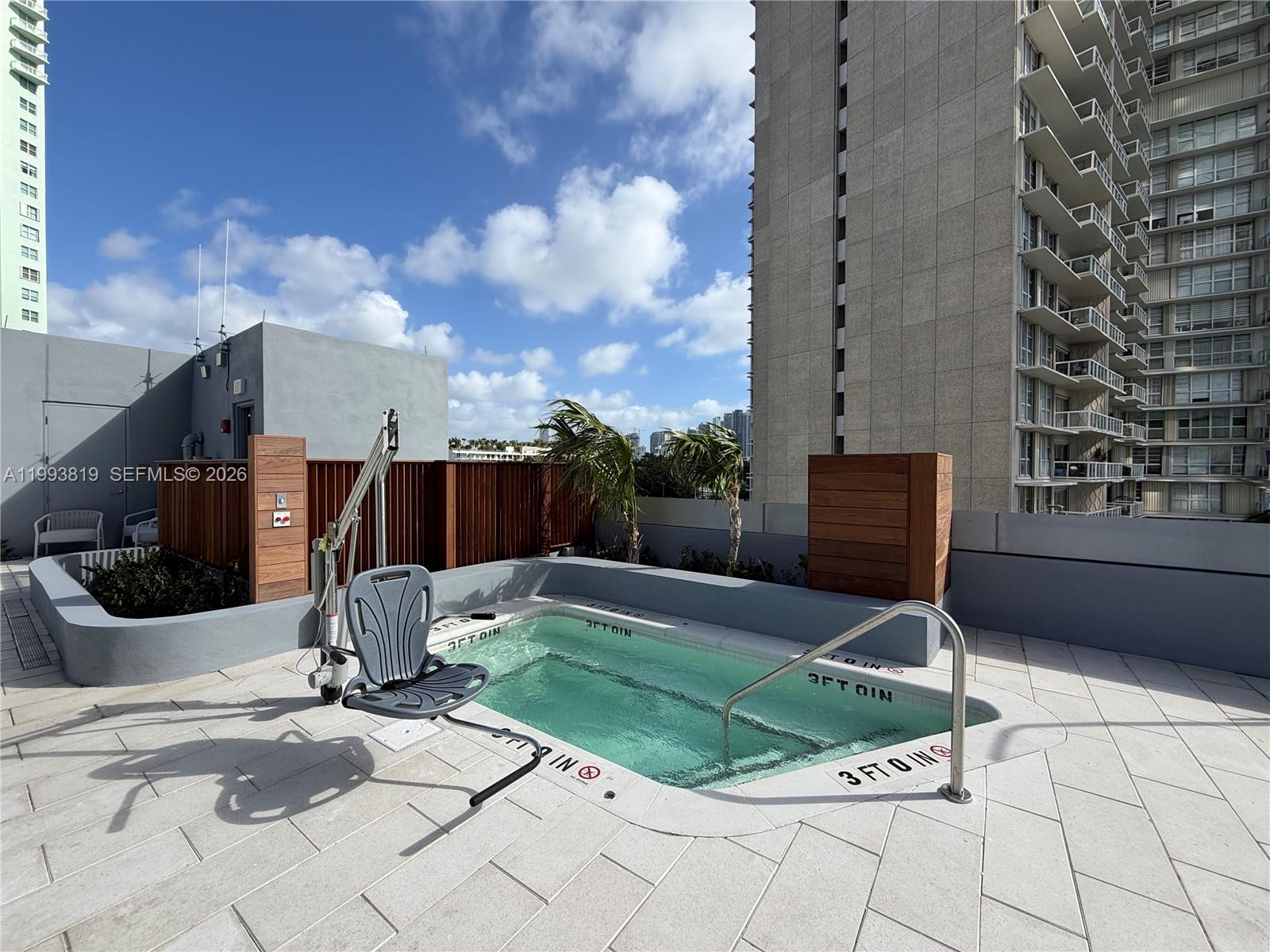 175 Southeast 25th Road, Unit 3102 Miami, FL 33129 - Photo 59 of 65 a view of a chair and table in the backyard