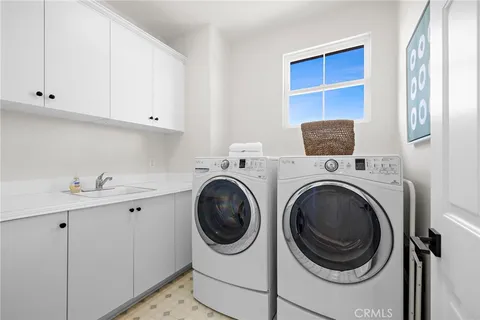a view of swimming pool with outdoor seating and city view
