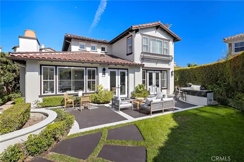 front view of a house with a bench