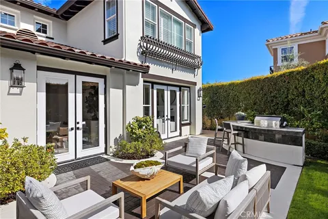 a view of a lake with a table and chairs