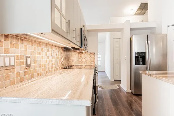 a kitchen with a sink and cabinets