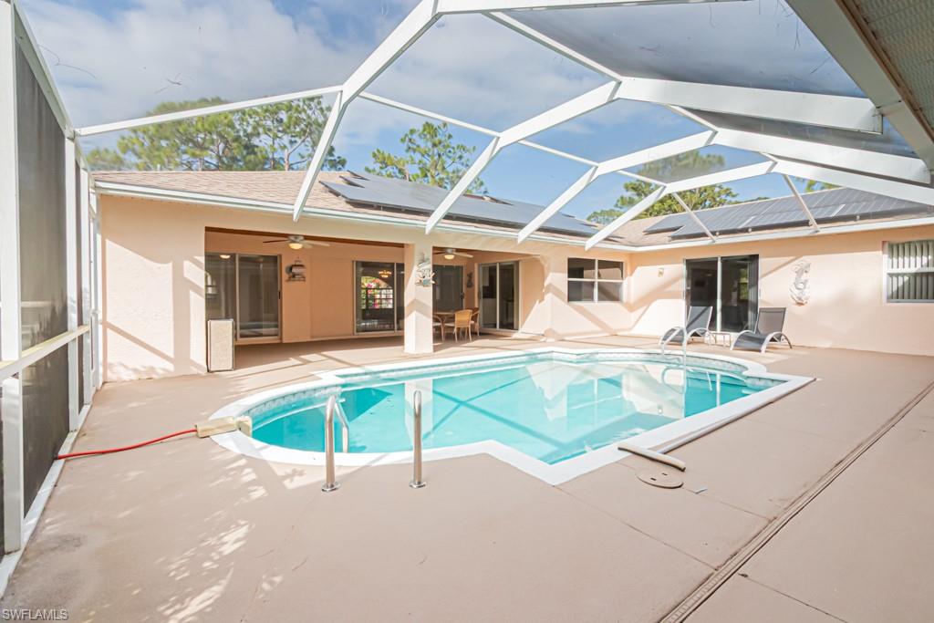 590 6th Street Northeast Naples, FL 34120 - Photo 15 of 50 Outdoor pool featuring a patio