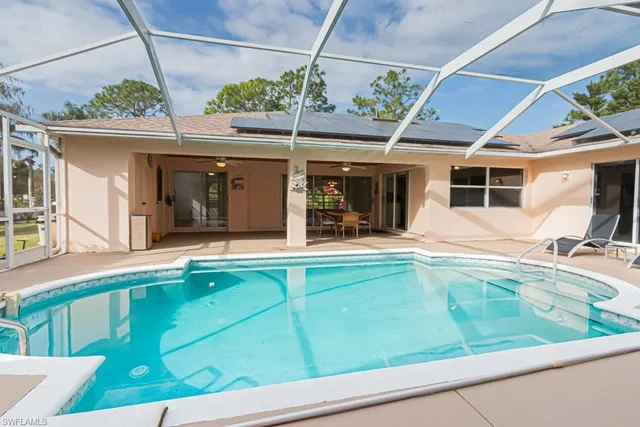 a view of a house with swimming pool