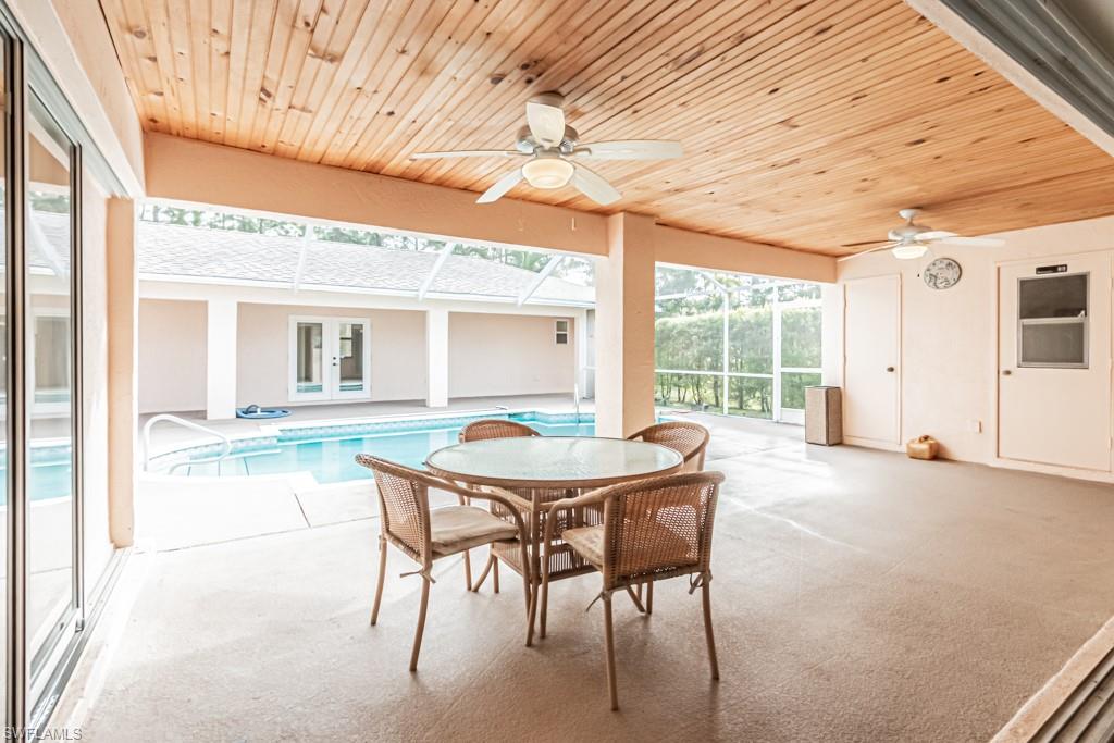 590 6th Street Northeast Naples, FL 34120 - Photo 20 of 50 Dining area looking out to pool