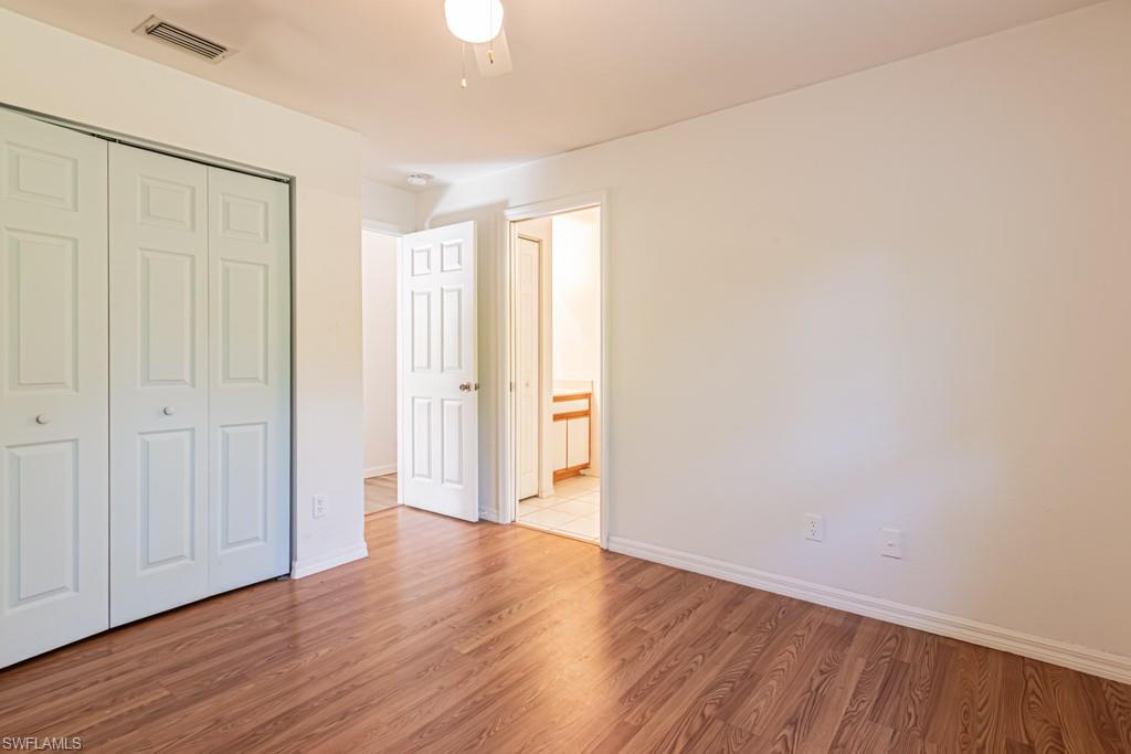 590 6th Street Northeast Naples, FL 34120 - Photo 22 of 50 Unfurnished bedroom with a closet