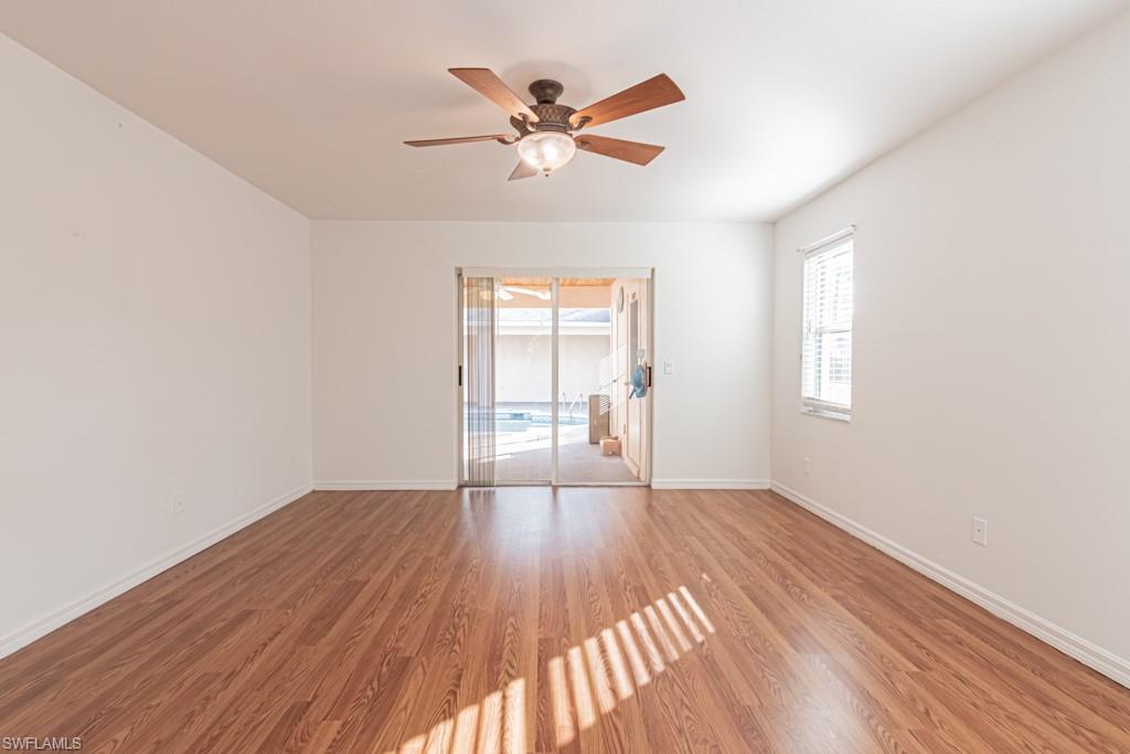 590 6th Street Northeast Naples, FL 34120 - Photo 29 of 50 Empty room featuring light wood-type flooring and a ceiling fan