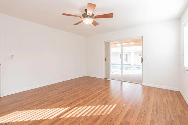 a bathroom with a tub a sink and a window