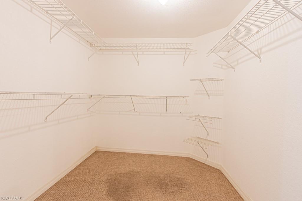 590 6th Street Northeast Naples, FL 34120 - Photo 33 of 50 Spacious closet with light carpet