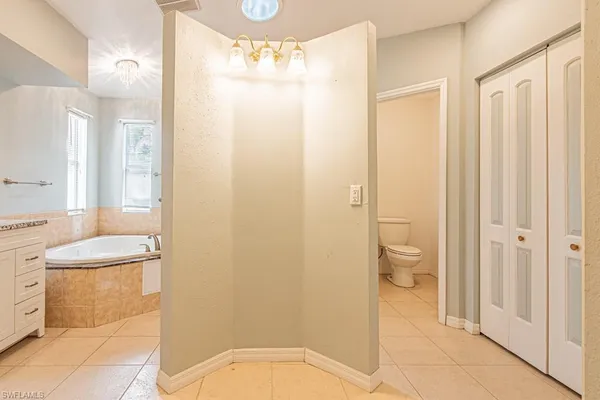 a bathroom with a tub and shower