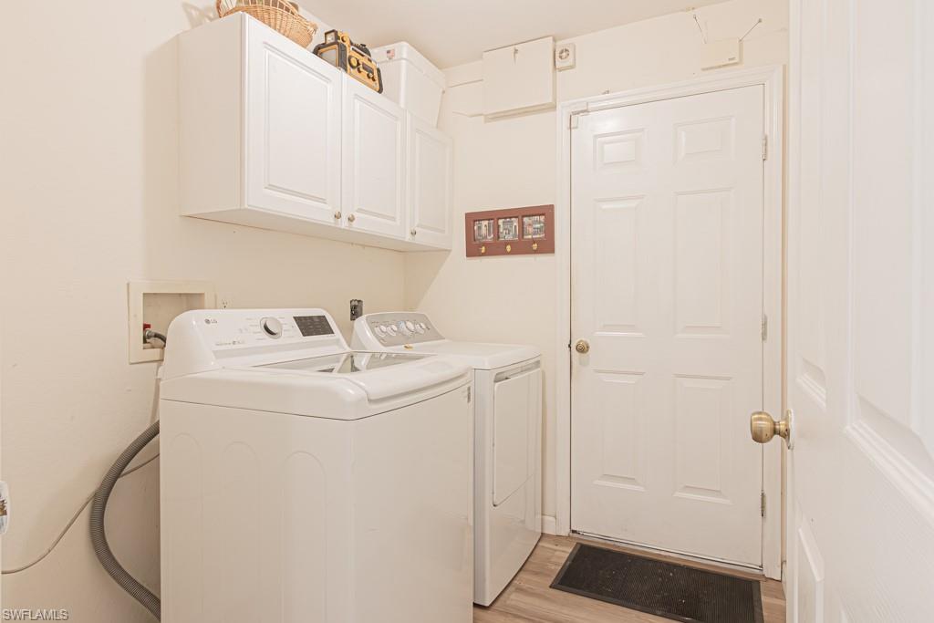 590 6th Street Northeast Naples, FL 34120 - Photo 46 of 50 Laundry room with cabinet space