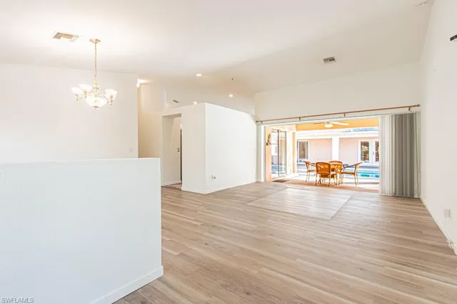 a view of a livingroom with wooden floor