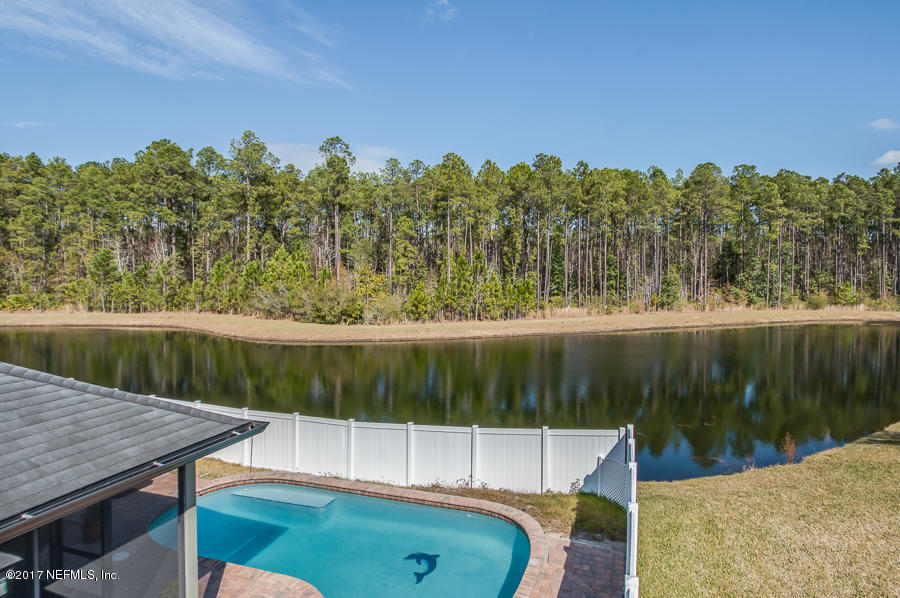 9141 Raptor Drive Jacksonville, FL 32221 - Photo 23 of 25 a view of a lake from a balcony