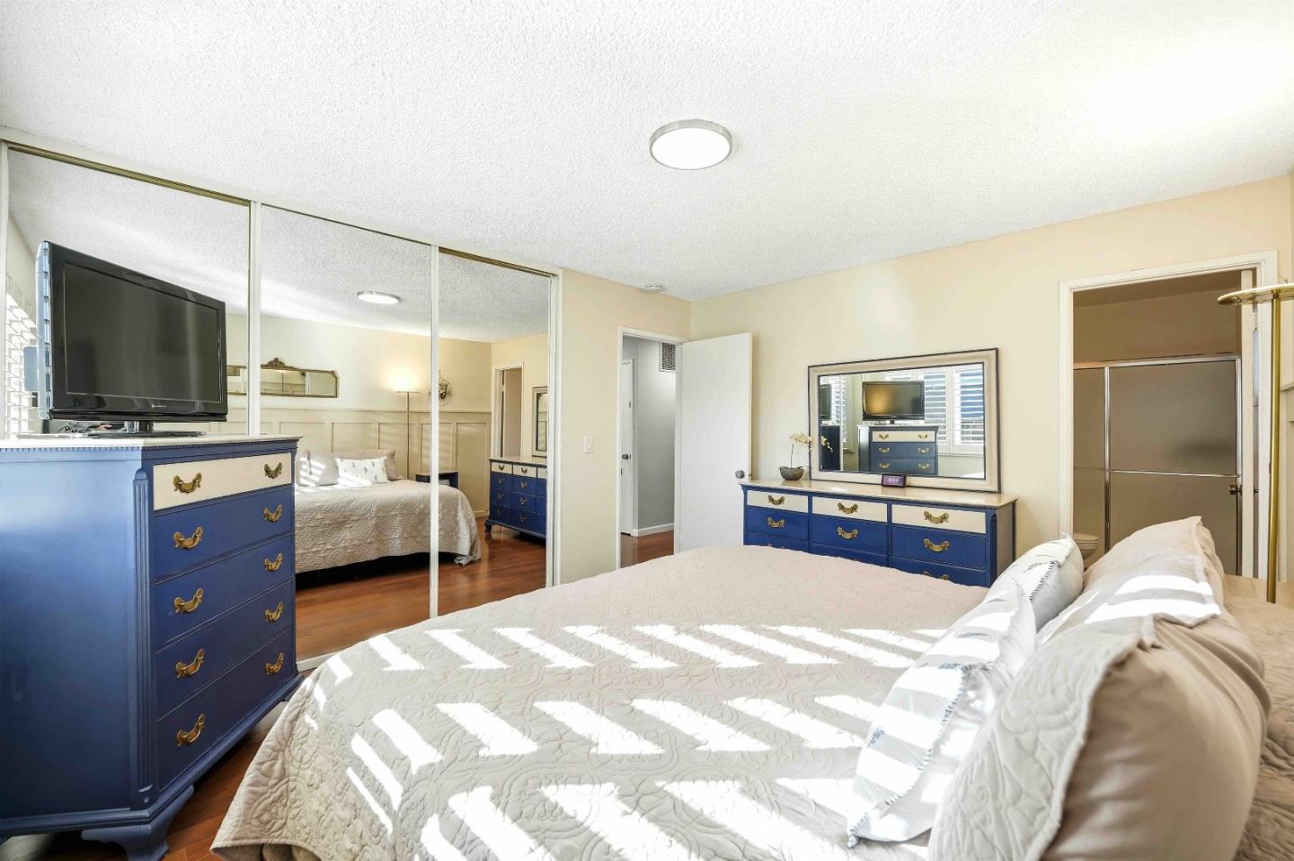 925 Blake Court Gilroy, CA 95020 - Photo 15 of 30 a bedroom with a bed and a flat screen tv