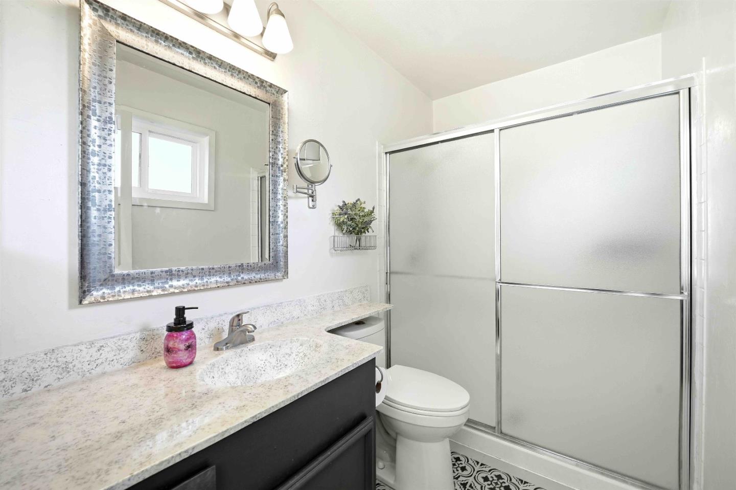 925 Blake Court Gilroy, CA 95020 - Photo 16 of 30 a bathroom with a granite countertop sink toilet and shower