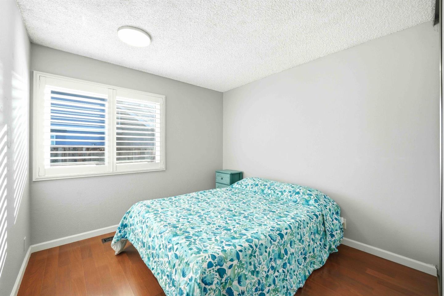 925 Blake Court Gilroy, CA 95020 - Photo 18 of 30 a bedroom with a bed and a window