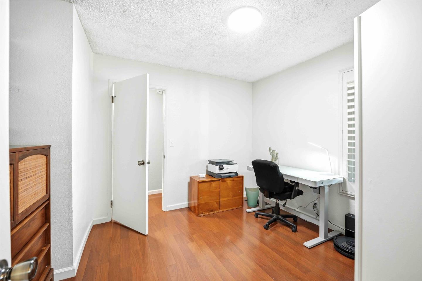 925 Blake Court Gilroy, CA 95020 - Photo 21 of 30 a view of a workspace with furniture and a window